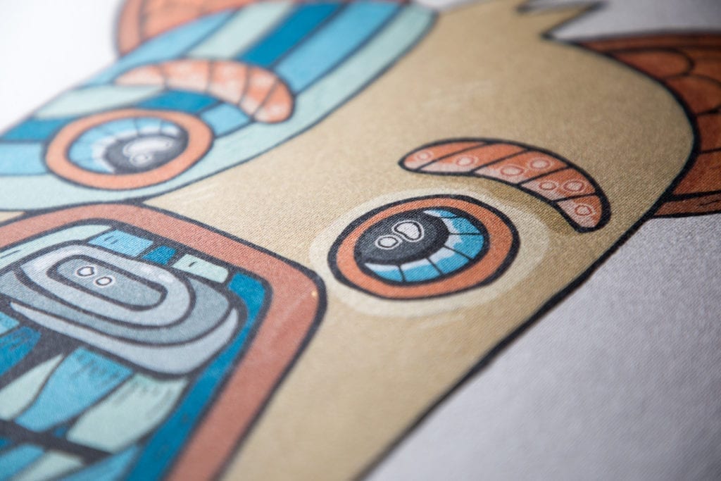 Détail d’une illustration multicolore imprimée sur textile